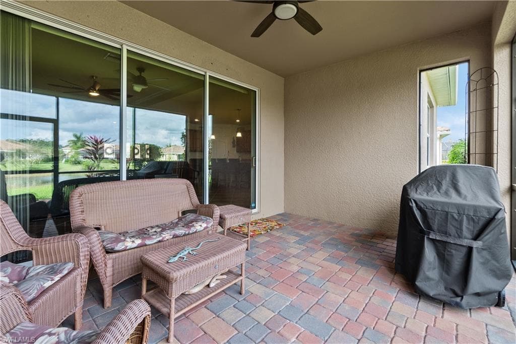 View of patio / terrace featuring grilling area, outdoor lounge area, and a ceiling fan