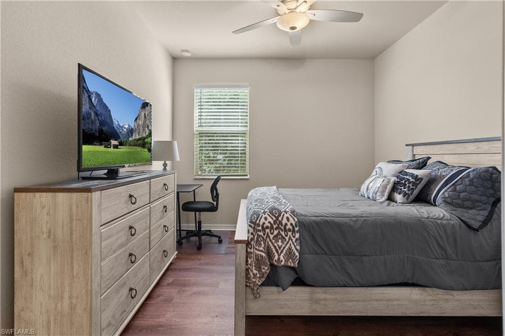 Guest en-suite Bedroom 2 featuring luxury vinyl floors, and a ceiling fan