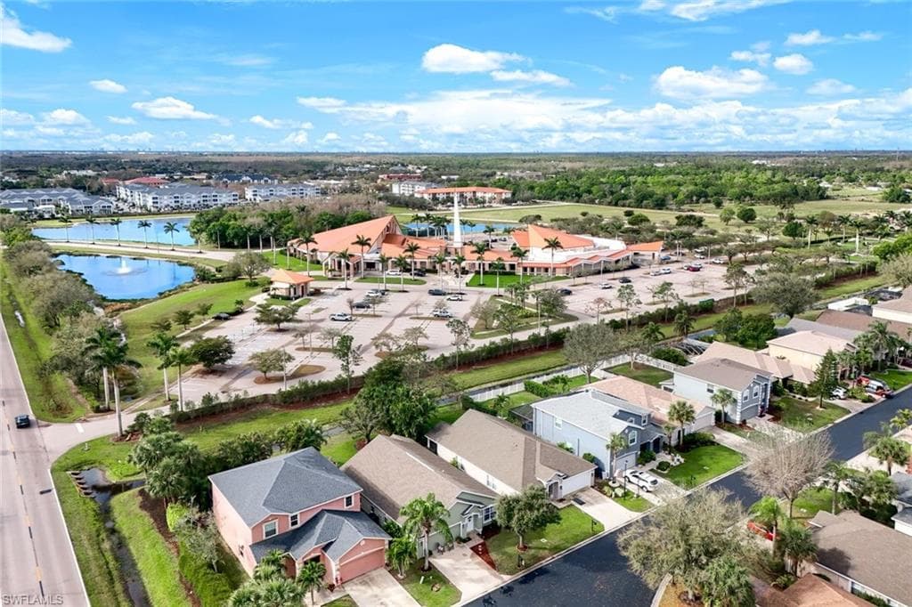 Drone / aerial view featuring a water view and a residential view