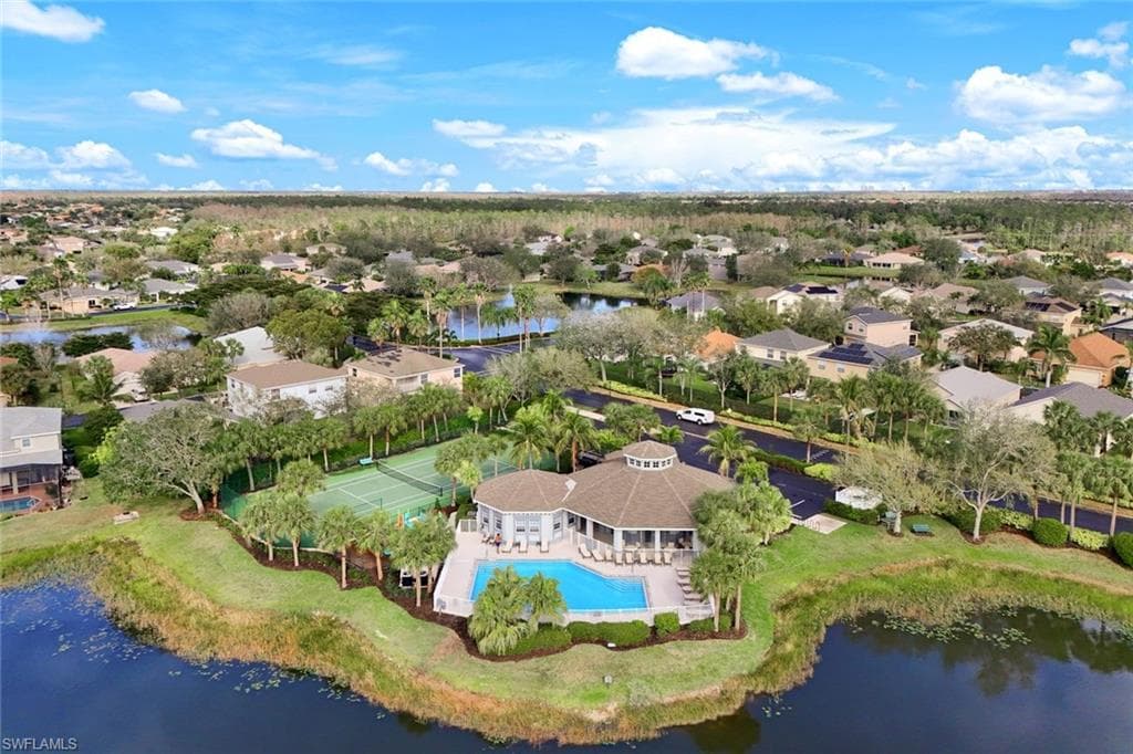 Aerial view with a water view and a residential view