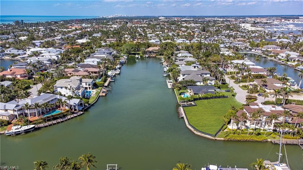 Aerial view of residential area with a nearby body of water