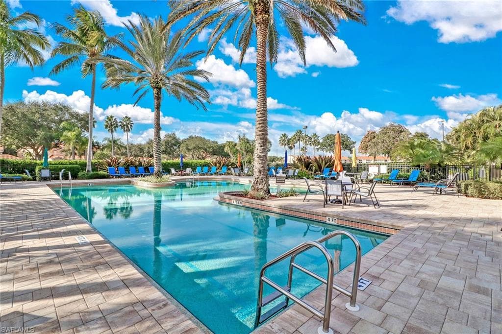 Community pool with a patio area