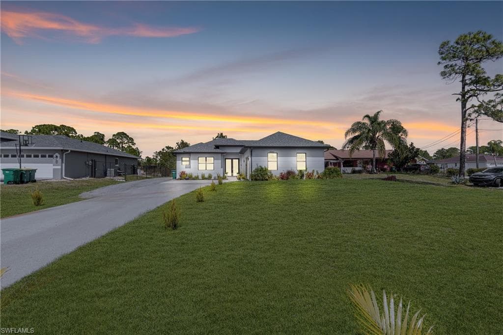 View of front of property featuring a front yard