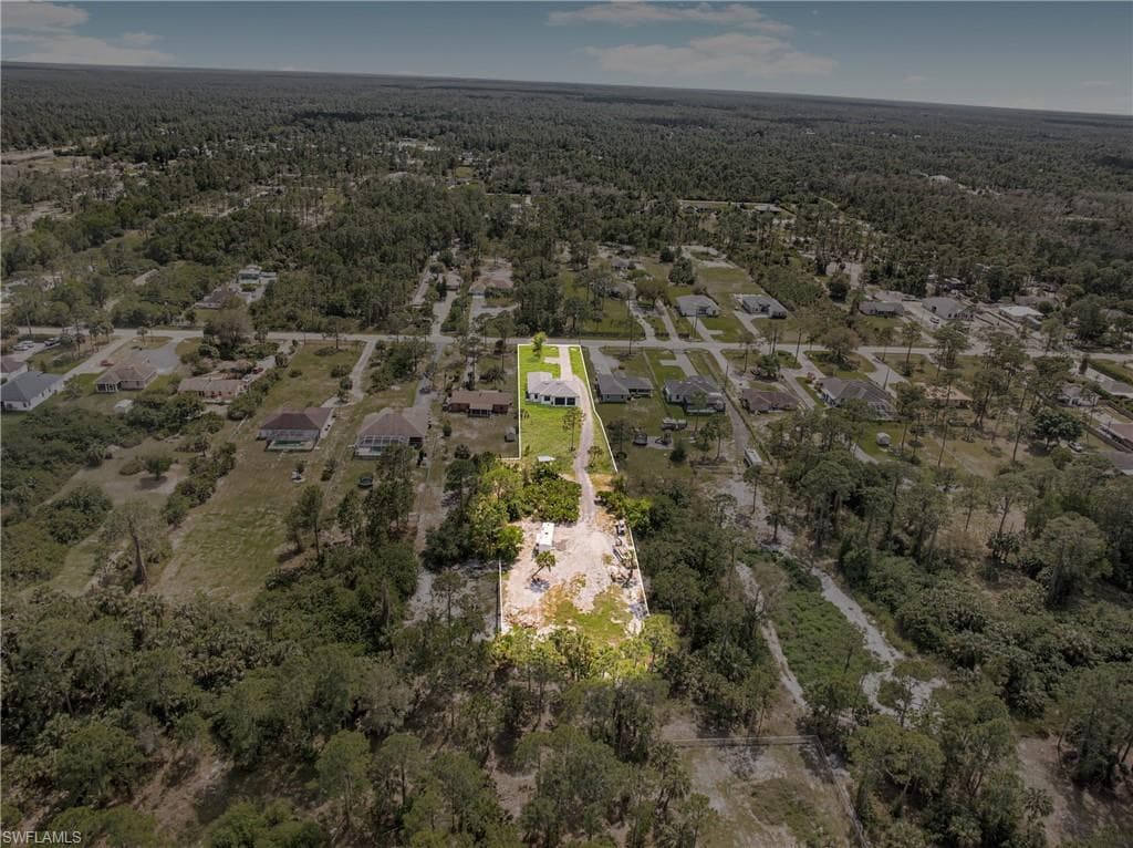Drone / aerial view featuring a view of trees