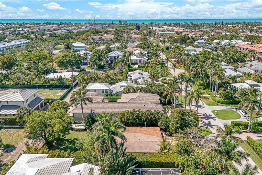 Drone / aerial view featuring a residential view and a water view