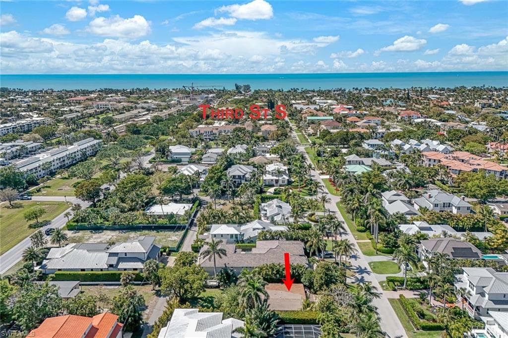 Bird's eye view featuring a water view and a residential view