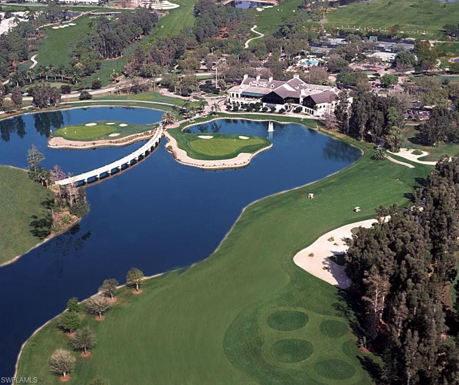 Aerial view featuring golf course view and a water view of the island greens of the Long Mean Golf Course.