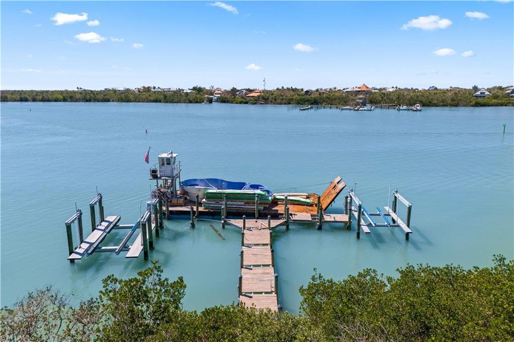 Dock and multiple boatlifts. Check out the view from the back of the home into the bay and back out to the Gulf.