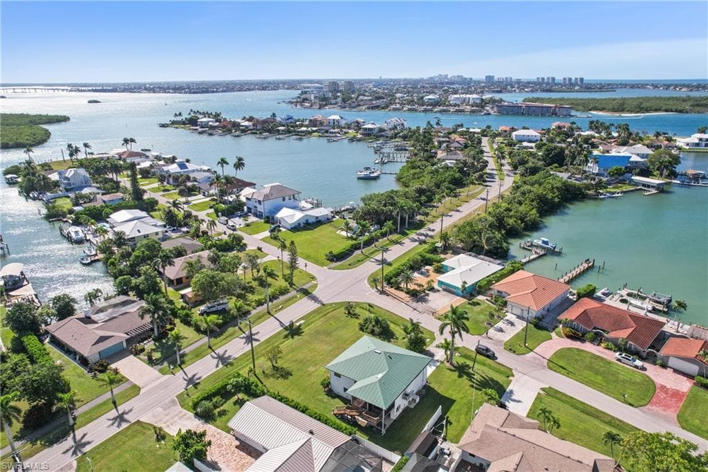 Aerial view of residential area featuring a large body of water