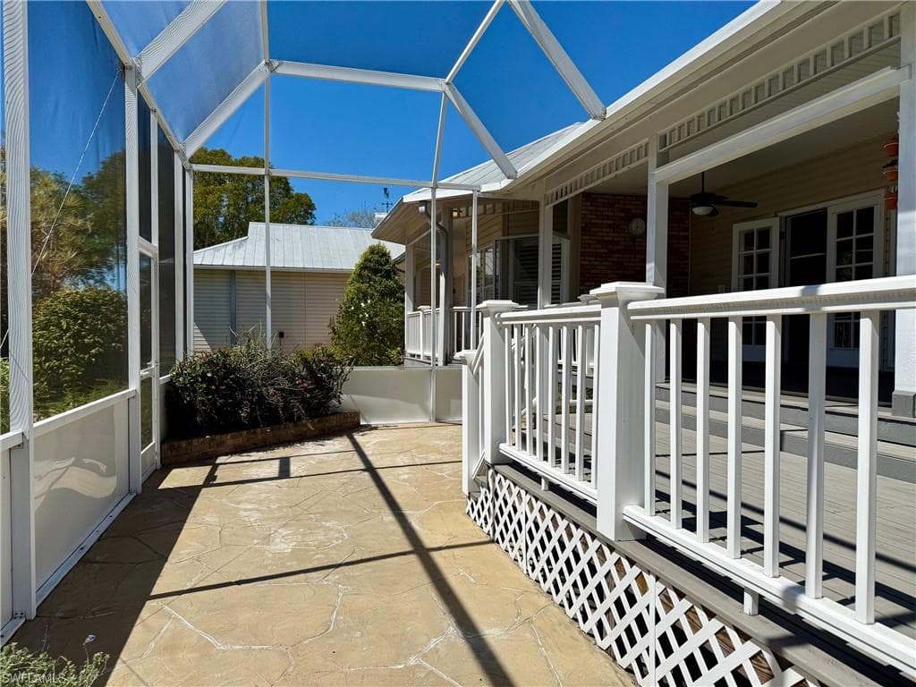 Sunroom featuring ceiling fan