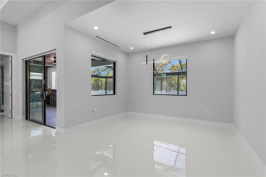 Spare room with visible vents, recessed lighting, and baseboards