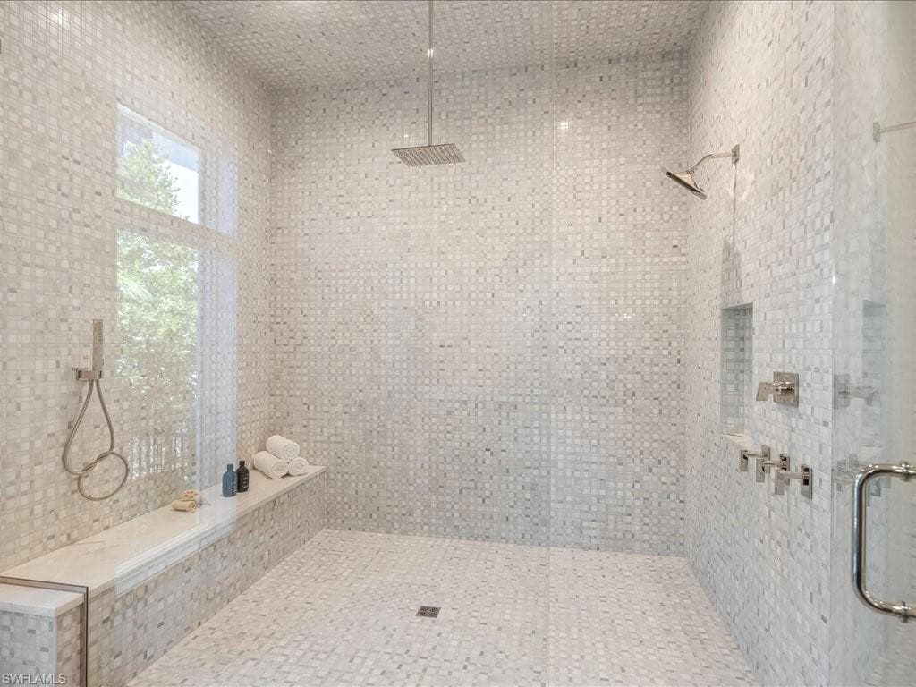 Bathroom featuring a tile shower