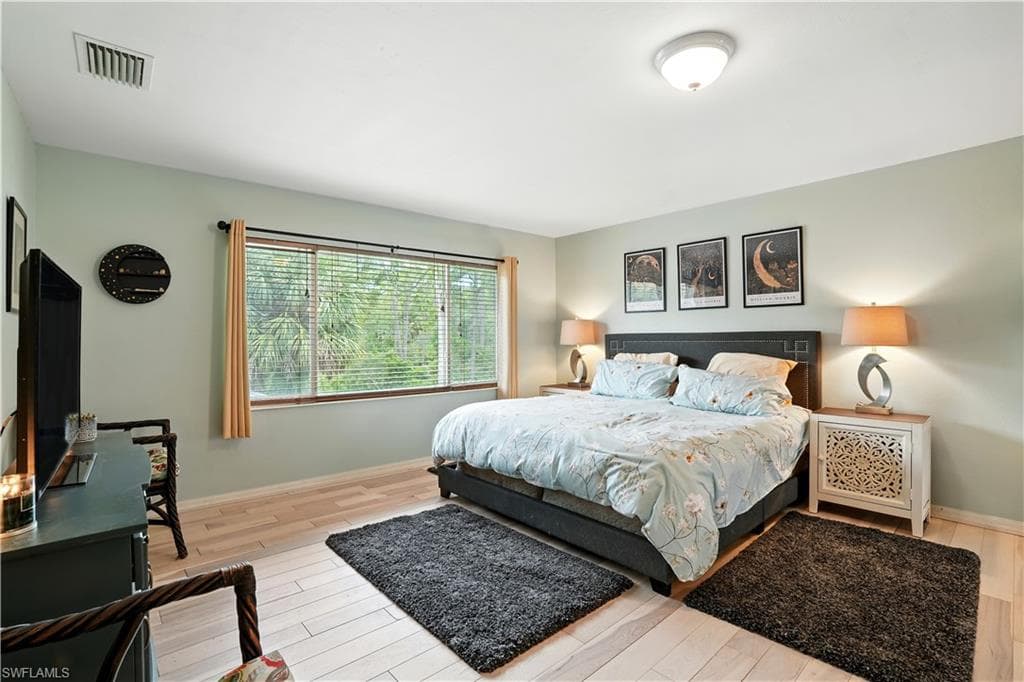 ChatGPT said:Spacious primary bedroom with large window framing serene preserve views, filling the room with natural light. Soft neutral tones, warm wood-look flooring, and modern lighting create a calm and inviting retreat. Ample space for a king bed and seating area makes it perfect for relaxing after a long day. Ideal for Southwest Florida living, this peaceful suite offers privacy, comfort, and style—just minutes from Gulf beaches, shopping, and dining.