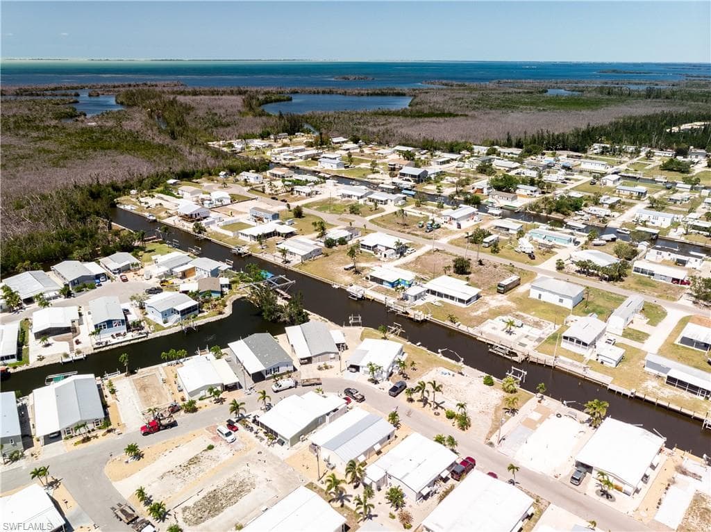 Aerial view featuring a water view and a residential view