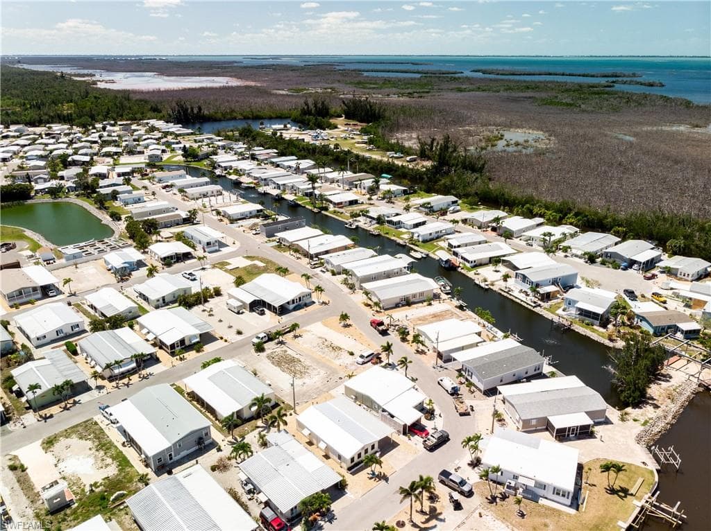 Aerial view with a water view and a residential view
