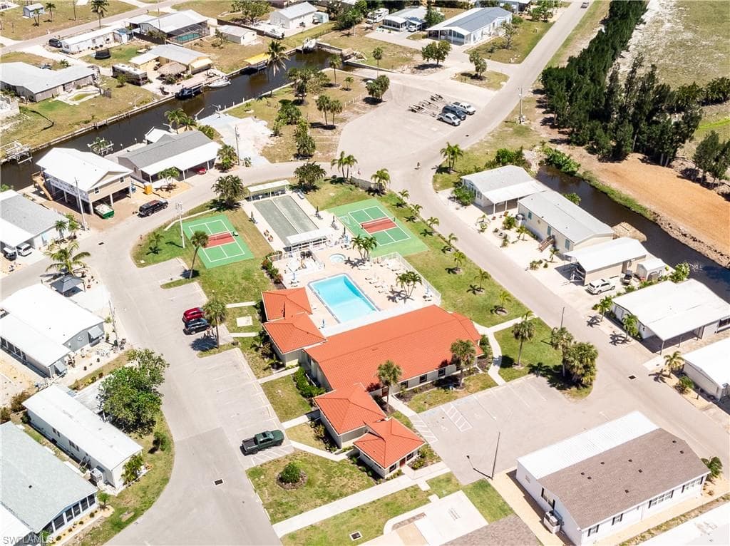 Aerial view featuring a water view and a residential view
