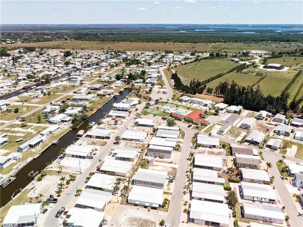 Aerial view featuring a water view and a residential view
