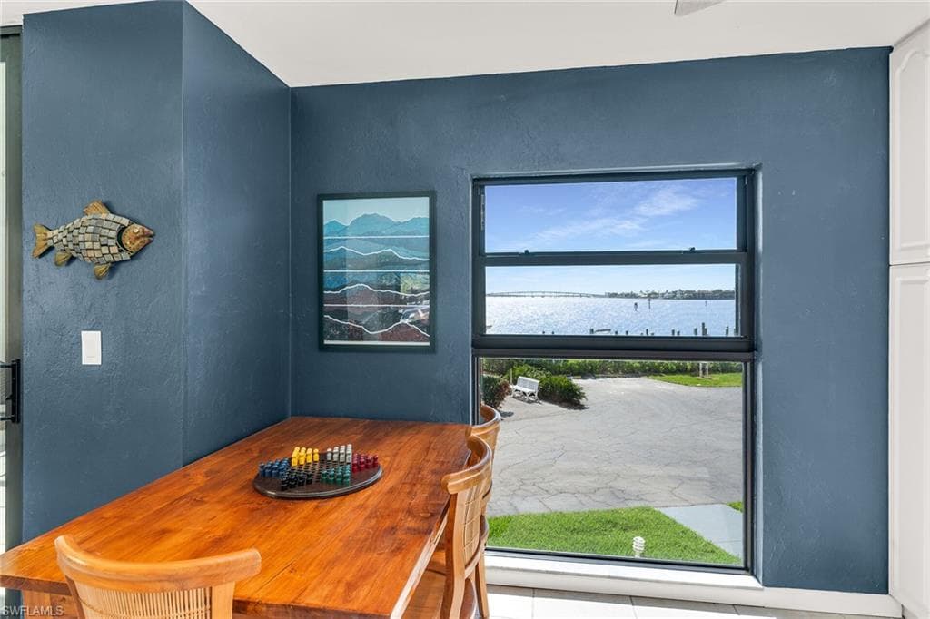 Dining room featuring a water view