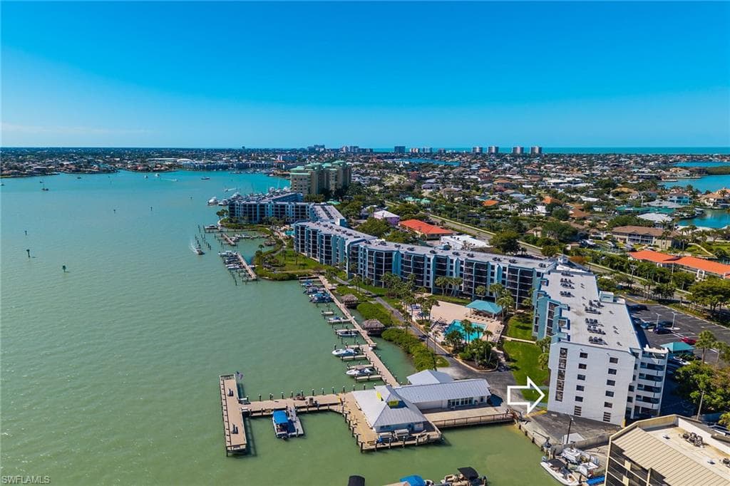 Drone / aerial view featuring a water view and a city view