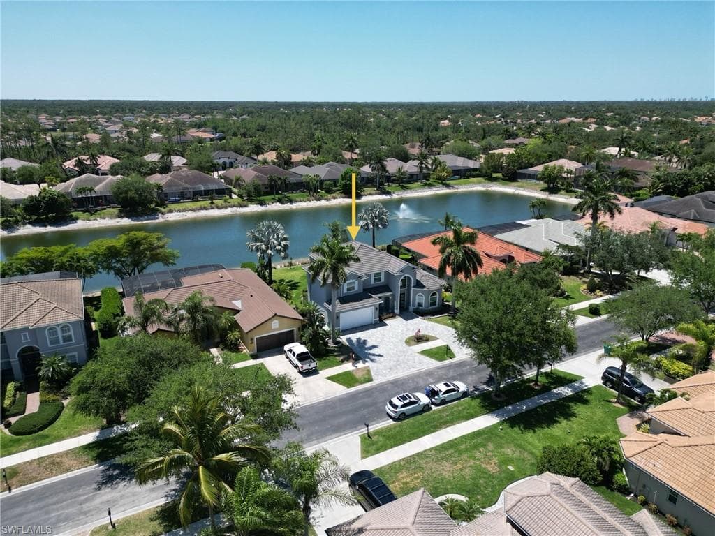 Aerial view with a residential view and a water view