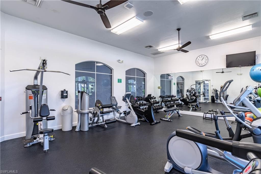 Exercise room with a ceiling fan