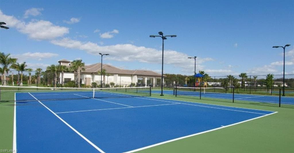 View of tennis court featuring community basketball court