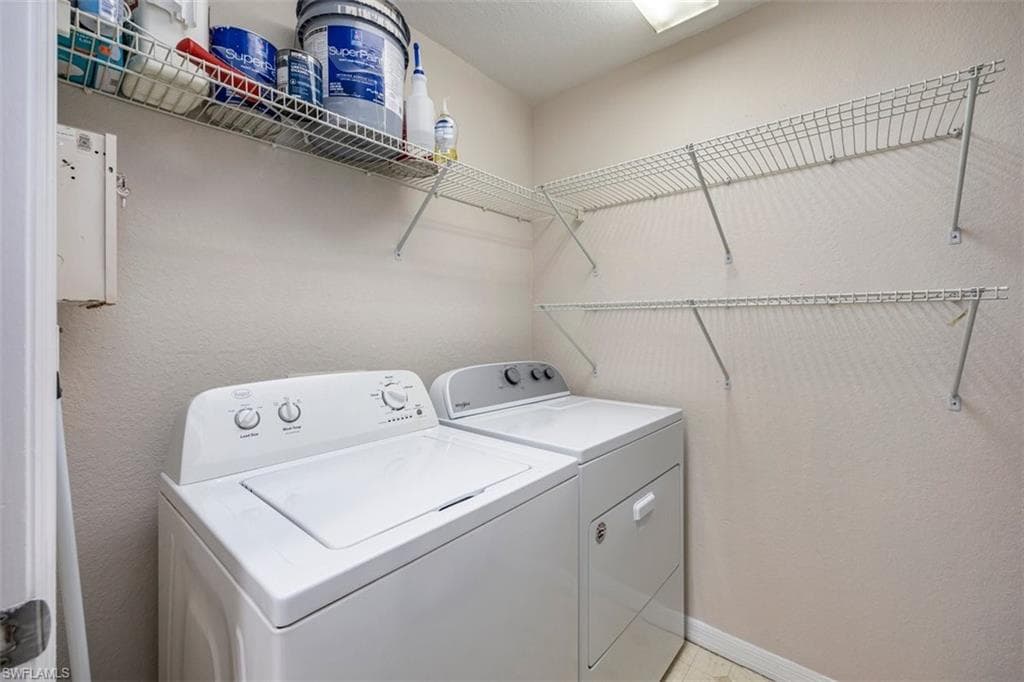 Laundry area featuring independent washer and dryer