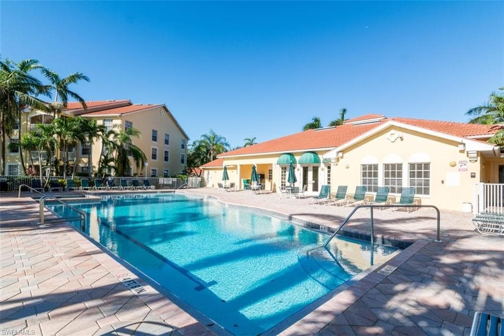 Community pool featuring a patio area