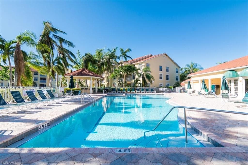 Community pool featuring a patio area and a gazebo
