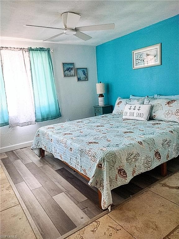 Bedroom featuring a textured ceiling and ceiling fan