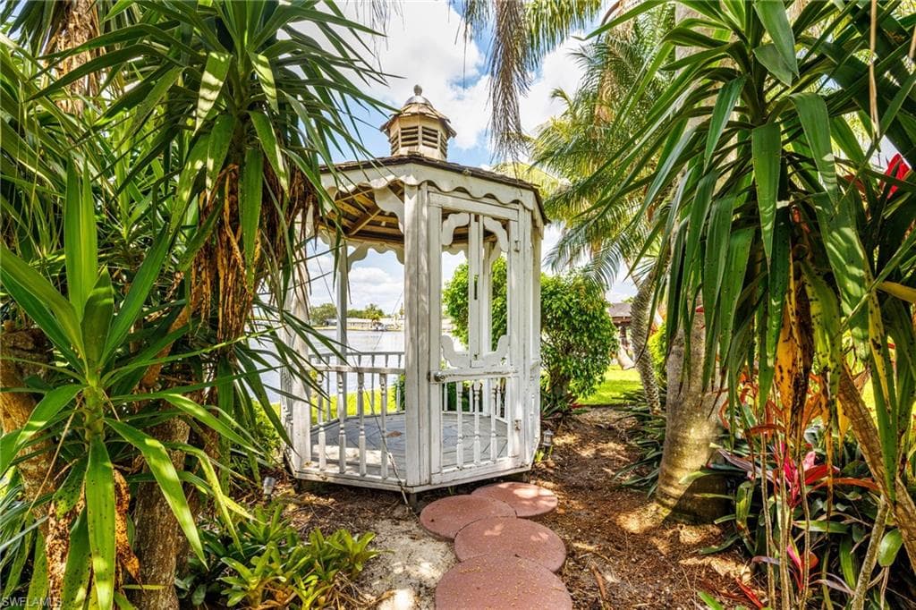 View of outdoor structure featuring a gazebo and a water view