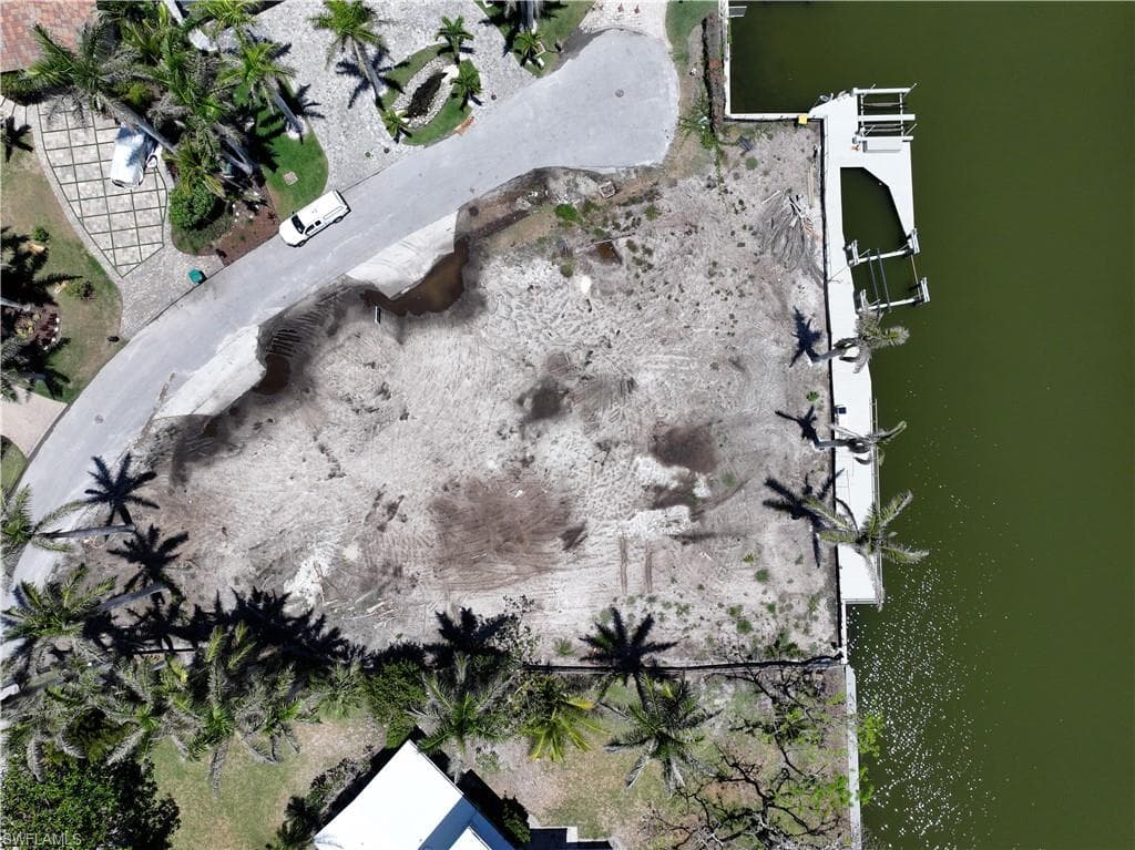 Aerial overview of property's location featuring a large body of water