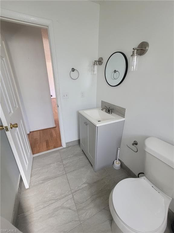 Bathroom with vanity and toilet