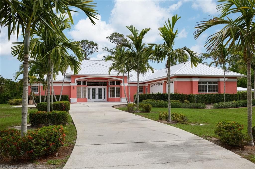 View of building exterior featuring driveway