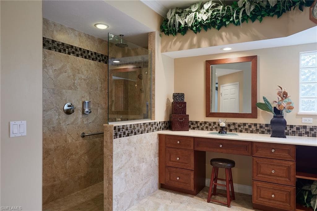 Full bath with walk in shower and vanity