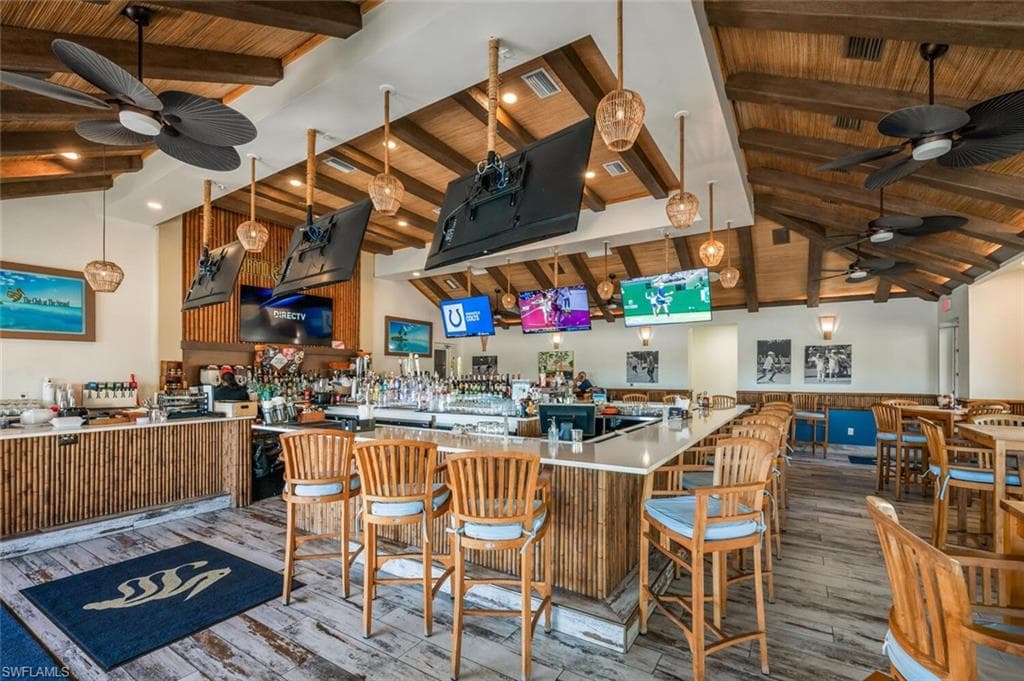 Kitchen with ceiling fan, wood finished floors, and wood ceiling
