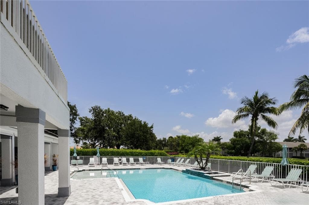 Community pool featuring a patio