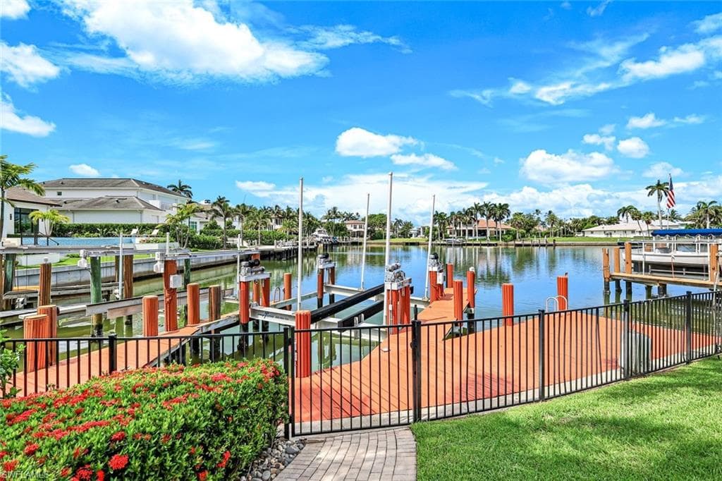 Dock area featuring 60 ton boat lift and a water view of Compass Pass.