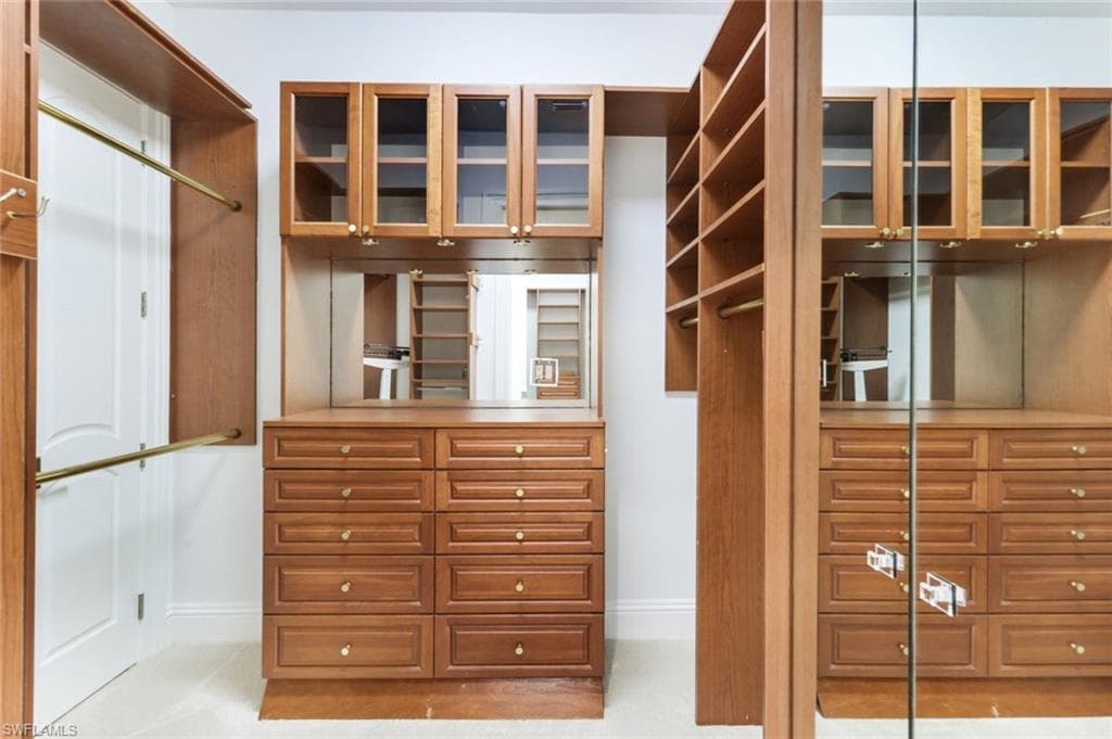 Master Bedroom boasts 2 large walk in closets with built ins.