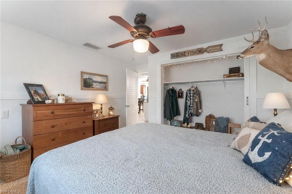 Bedroom featuring a closet and a ceiling fan