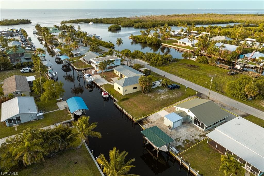Aerial perspective of suburban area with a nearby body of water