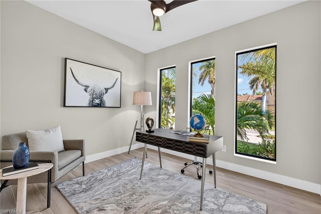Office featuring a ceiling fan and light wood-style floors