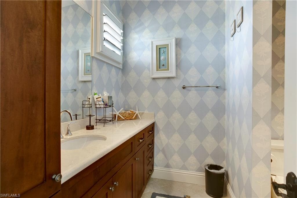 Bathroom with vanity and tile patterned floors
