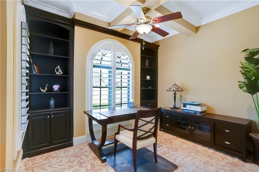 Home office / Library featuring walnut floors, crown molding, a ceiling fan, and beam ceiling. Can be used as an optional 4th bedroom.