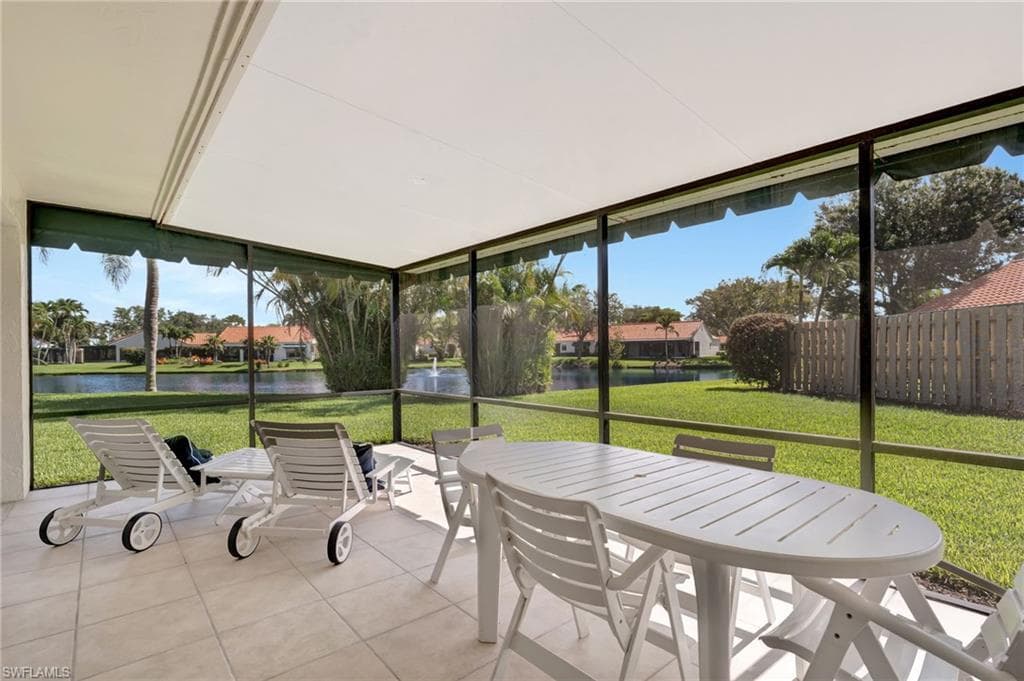Sunroom / solarium featuring outdoor dining area, a water view, and plenty of natural light