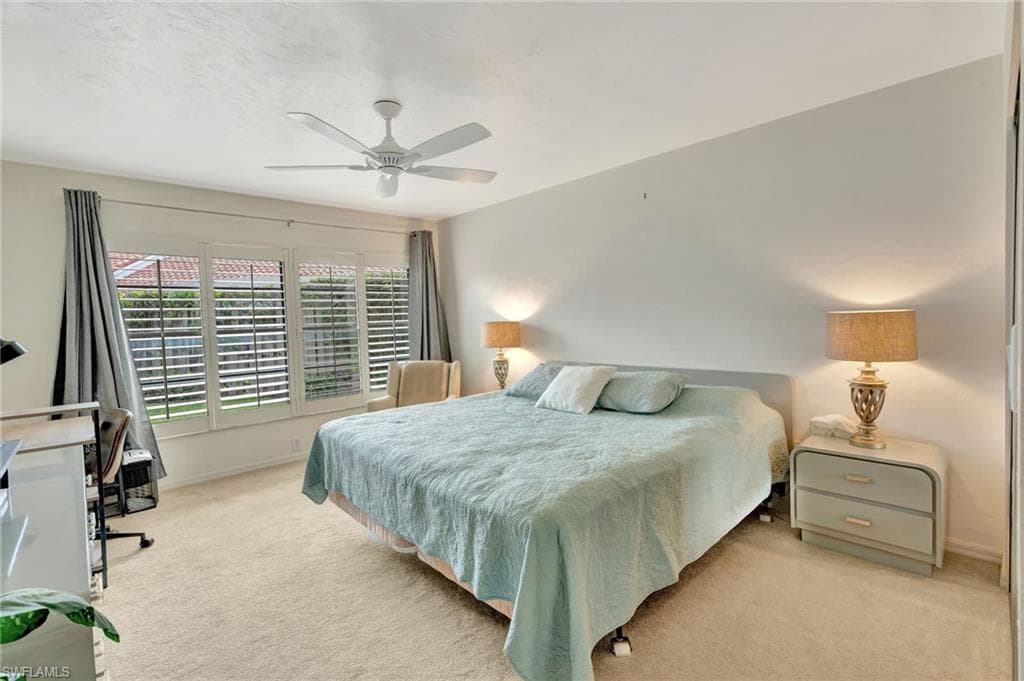 Bedroom featuring carpet flooring and ceiling fan