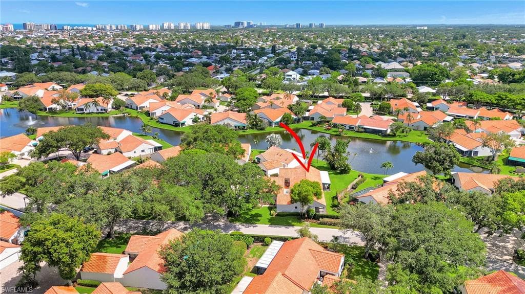 Aerial perspective of suburban area featuring a large body of water