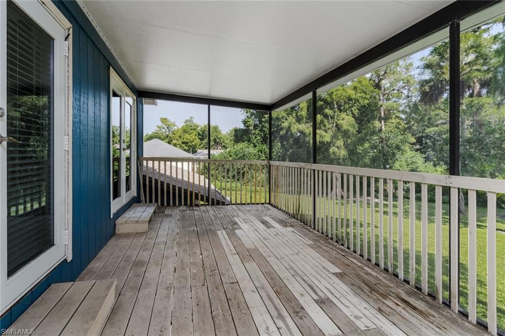 Wooden deck featuring a yard