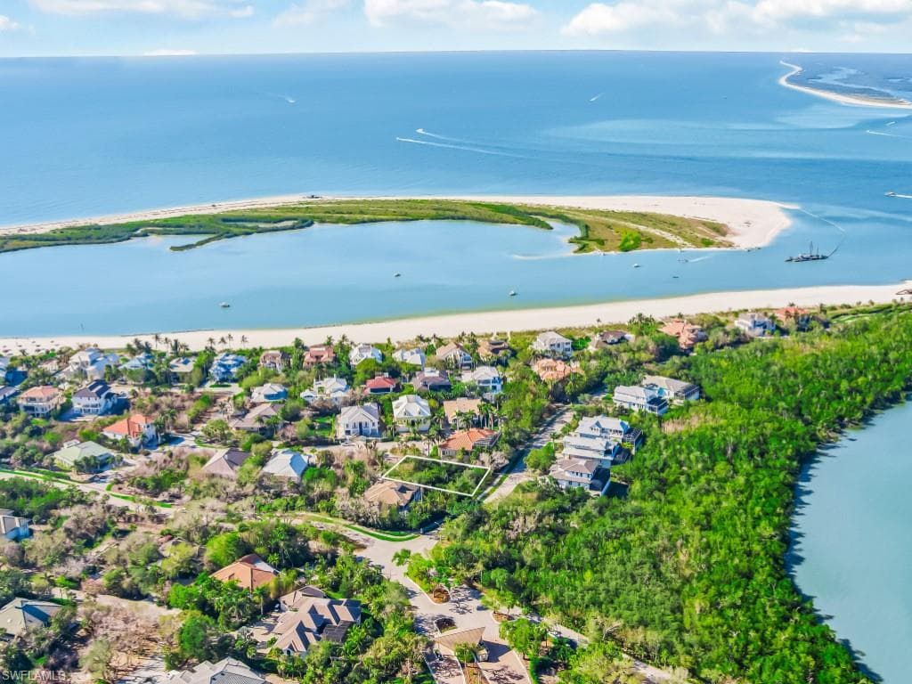 Aerial perspective of suburban area with a large body of water