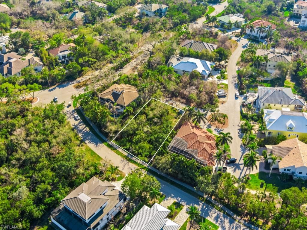Aerial perspective of suburban area featuring property parcel outlined